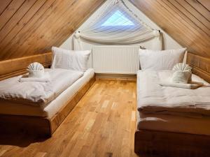 Postel nebo postele na pokoji v ubytování Goralská Vila Lomnica