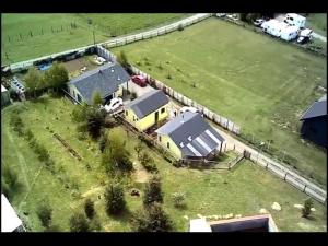 an aerial view of a house in a field at cabaña los teros in Coihaique