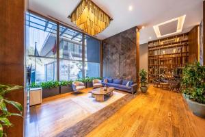 a living room with a couch and a table at Radisson Residences Vadistanbul in Istanbul