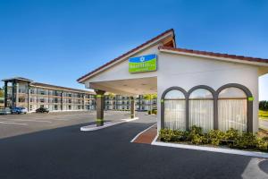 a rendering of the front of a hospital building at SureStay Hotel by Best Western Clermont Theme Park West in Kissimmee