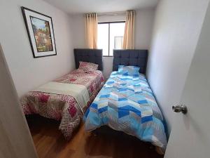 Llit o llits en una habitació de Cálido apartamento, acogedor
