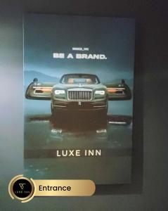 a poster of a car on display in a museum at 4 Bedroom House, Heathrow Airport, Luxe Inn in Colnbrook