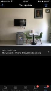 a screenshot of a room with a table and two chairs at Homestay 05 in Vung Tau