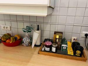 a kitchen counter with a tray of food and fruits at Eiffel Tower Oasis 30m from Eiffel Tower in Paris