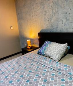 a bedroom with a bed with a pillow on it at #3 Luxury Suite en Puerto Santa Ana in Guayaquil
