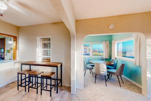 a kitchen and dining room with a table and chairs at Pacific Princess in Crescent City