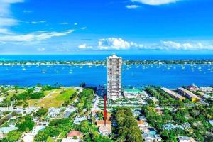 an aerial view of a tall building next to the water at Rockaway Beach House in West Palm Beach