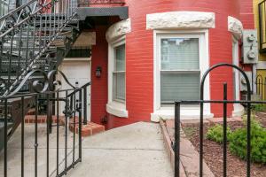 a red house with a staircase in front of it at Viola’s Place in Washington