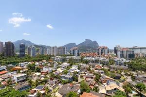 an aerial view of a city with buildings and mountains at Flat Ocean View in Rio de Janeiro