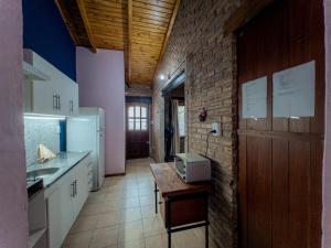 a kitchen with a sink and a counter in it at Refugio Bohemio-con patio y asador in Villa María