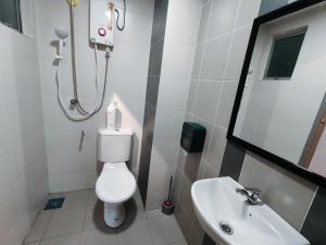 a bathroom with a toilet and a sink at INS Pavillion by irainbow in Ipoh