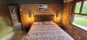 Postel nebo postele na pokoji v ubytování Chalé confortável para família. + 20 fotografií