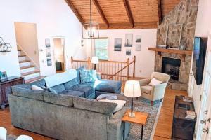a living room with a couch and a fireplace at Hester Gap - wineries, AT hiking + Dahlonega/Helen in Cleveland