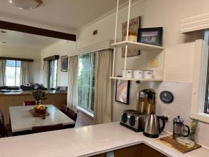 a kitchen with a counter with a coffee maker on it at Bellevue Farmstay in Scotts Creek
