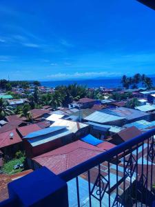 an aerial view of a town with buildings and the ocean at 2 BD, 2BR Condo Rental,Toril in Davao City