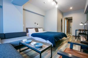 מיטה או מיטות בחדר ב-Minn Juso