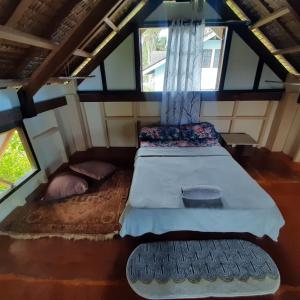 Postel nebo postele na pokoji v ubytování BlueWave Surf Stay