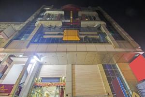 a tall building with a yellow slide on it at Super Collection O Regal Near ISKON TEMPLE , ABIDS in Hyderabad