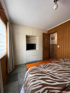Postel nebo postele na pokoji v ubytování Casa Lican Ray