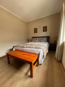 Postel nebo postele na pokoji v ubytování Casa Lican Ray
