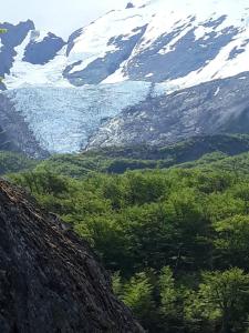 a view of a valley with snow covered mountains at Rufa’S in El Chalten