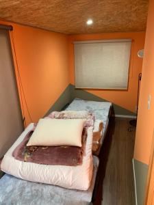 Postel nebo postele na pokoji v ubytování 民泊 福来