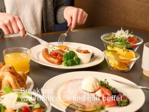 a person eating breakfast with inertia dish and half buffet at sequence KYOTO GOJO in Kyoto