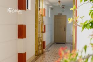 a hallway with a door in a building at HOTEL RUTA DEL SOL in Barrancabermeja