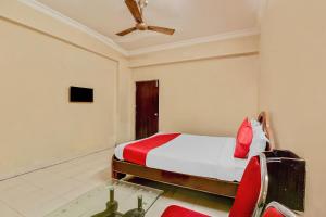 a bedroom with a bed and a ceiling fan at Sahasra Residency 43619 Near Nexus Hyderabad in Hyderabad