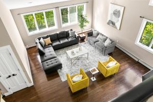 an overhead view of a living room with a couch and chairs at Awesome Country Retreat - 5BR - Private & Peaceful in Monroe