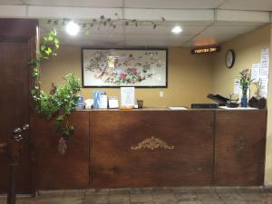 a reception desk in a store with a picture on the wall at Fairview Inn & Suite in Jonesboro