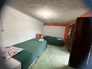 CARIBbEAN Paradise Hotel客房内的一张或多张床位
