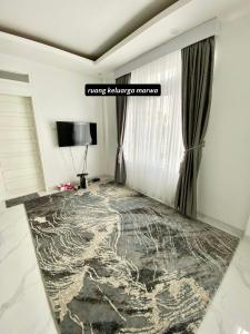Tempat tidur dalam kamar di Villa Shafa Marwa