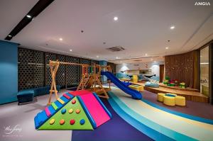 a play room with a slide and a playground at CONDOTEL 5 SAO THE SÓNG VŨNG TÀU Mr VƯƠNG in Vung Tau