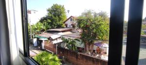a view of a building from a window at Rendezvous Oldtown Chiangmai SHA Extra Plus in Chiang Mai