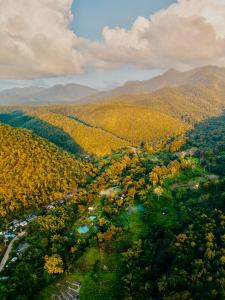 an aerial view of a valley with trees and mountains at Fern Resort Mae Hong Son in Mae Hong Son