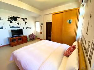 Letto o letti in una camera di Green Field Sweet House