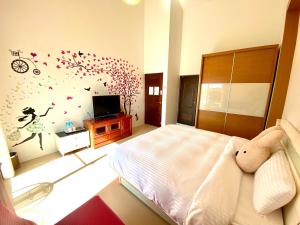 TV o dispositivi per l'intrattenimento presso Green Field Sweet House