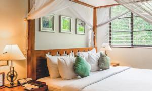 Voodi või voodid majutusasutuse Colombo Court Hotel & Spa toas
