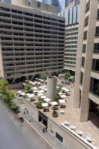 an overhead view of a building with umbrellas in a courtyard at Discover Bond Street in Sydney