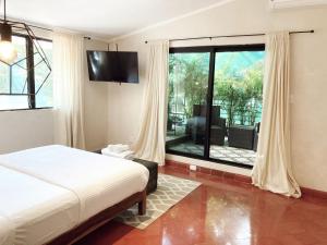 Postel nebo postele na pokoji v ubytování Hotel Boutique KAA