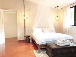 Postel nebo postele na pokoji v ubytování Hotel Boutique KAA