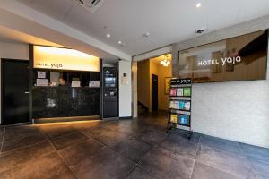 a hotel room with a hotel yoyo sign on the wall at Hotel Yaja Masan Odong Branch in Masan