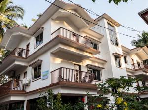 a large white building with balconies on it at Seacastle luxury apartments in Consua