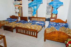 Ein Bett oder Betten in einem Zimmer der Unterkunft Antique Tourist Lodge