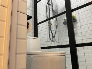 a bathroom with a shower and a toilet at Jessie Home in Bukit Mertajam