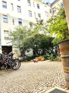 a group of motorcycles parked in front of a building at Cozy designer apartment in Friedrichshain in Berlin