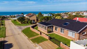 an aerial view of a brick house with a black roof at Leadwood House in Jeffreys Bay