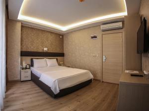 Postel nebo postele na pokoji v ubytování Payidar Hotel