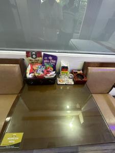a table with some food on top of it at Hoàng Gia Long Biên Hotel in Hanoi